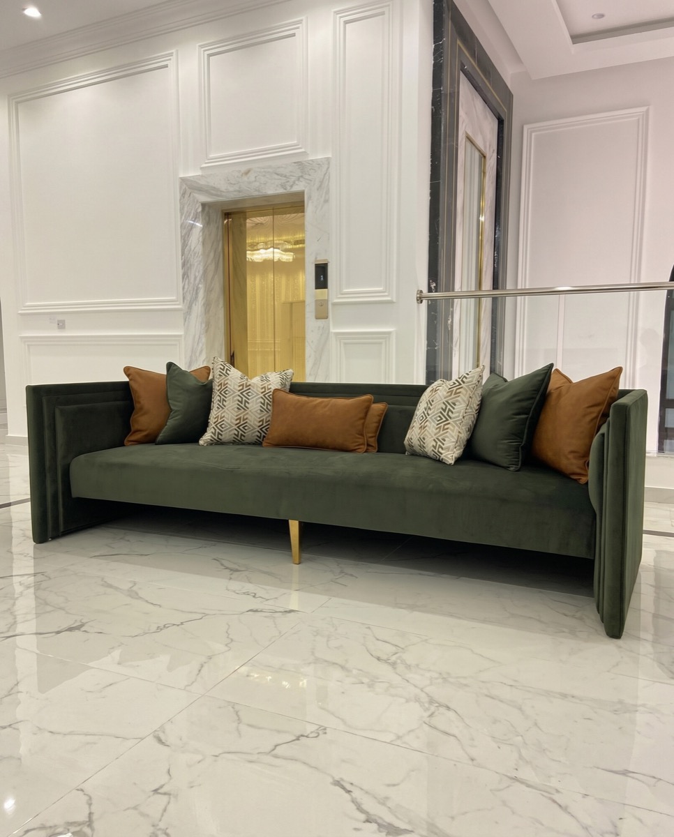 After: The green sofa, from a quick site snapshot to a catalog shot with deliberate styling and light.